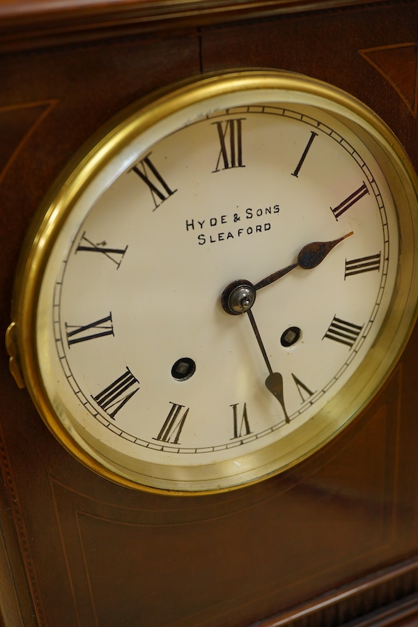 An early 20th century mahogany mantel clock, the dial inscribed Hyde & Sons, Sleaford, 41cm high